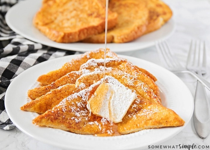 Pumpkin French toast drizzled with maple syrup and sugar powder. 