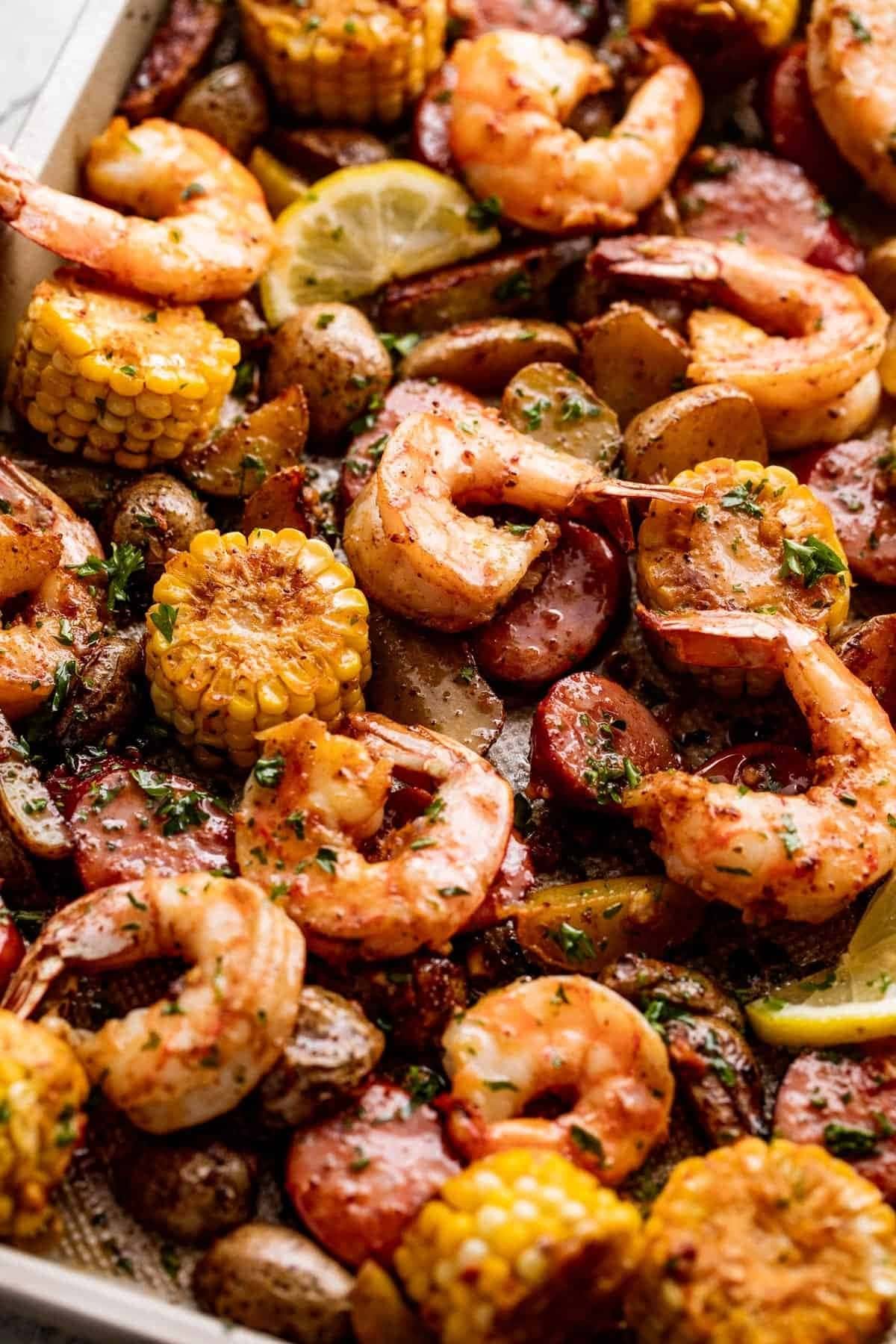 Shrimp broil with corn, potatoes, and sausage cooked in a sheet pan.