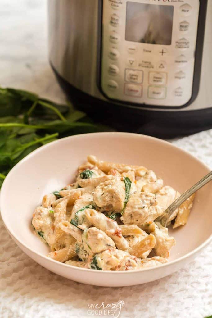 Tuscan Chicken Pasta with Spinach in a Bowl