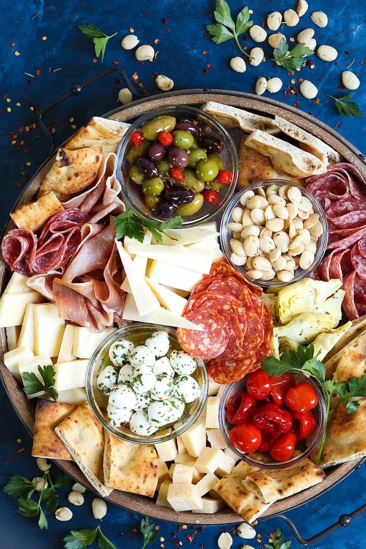 Platter with meats, cheeses, fruits, and veggies.