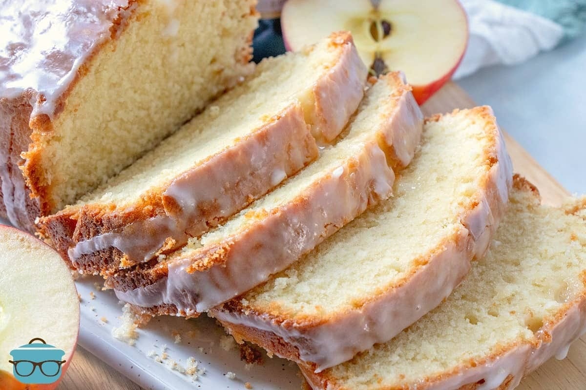 Sliced loaf cake drizzled with sugar glaze.