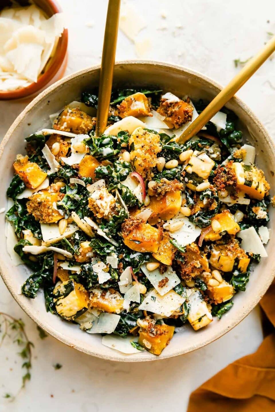 Autumn salad with massaged kale, shaved parmesan, toasted pine nuts, parmesan roasted delicata squash "croutons," and Caesar dressing.