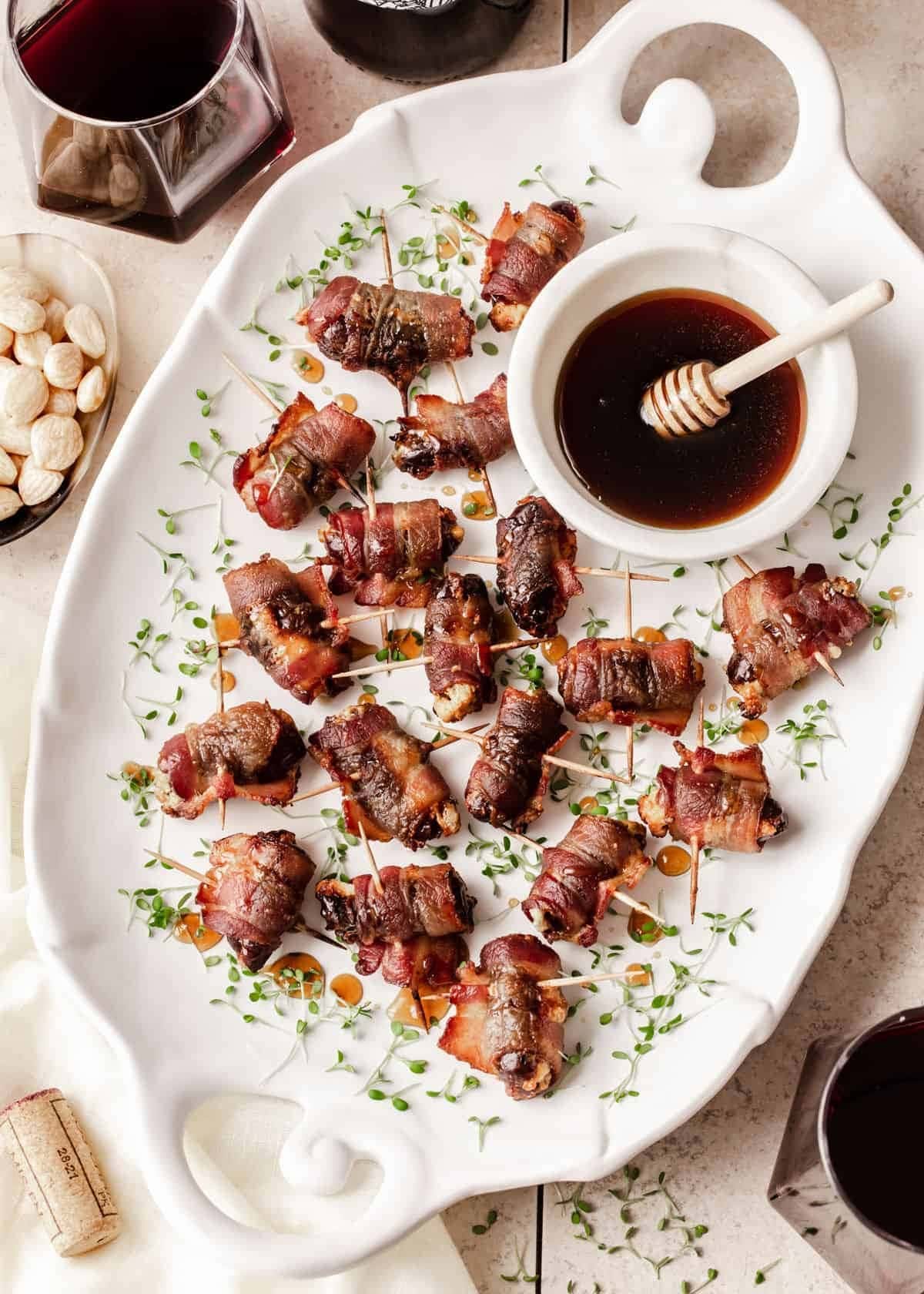Dates wrapped in bacons on stick. 