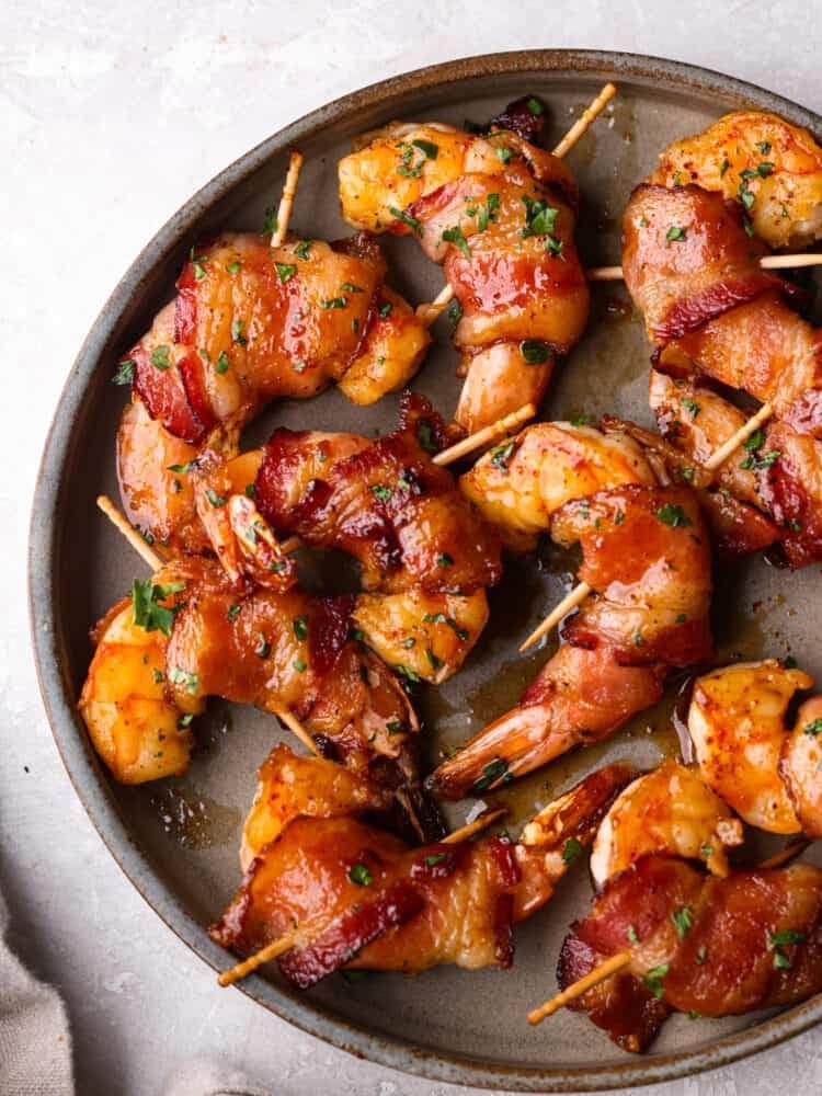 Bacon wrapped shrimps on skewers. 
