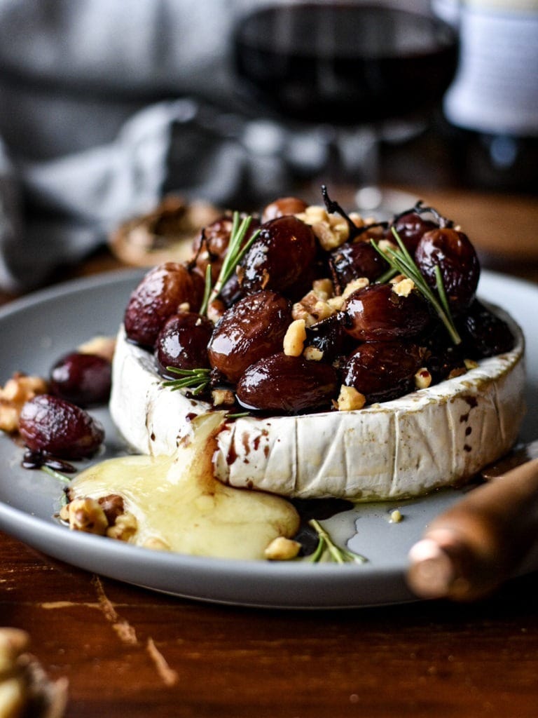 Baked Brie with Roasted Grapes on top.
