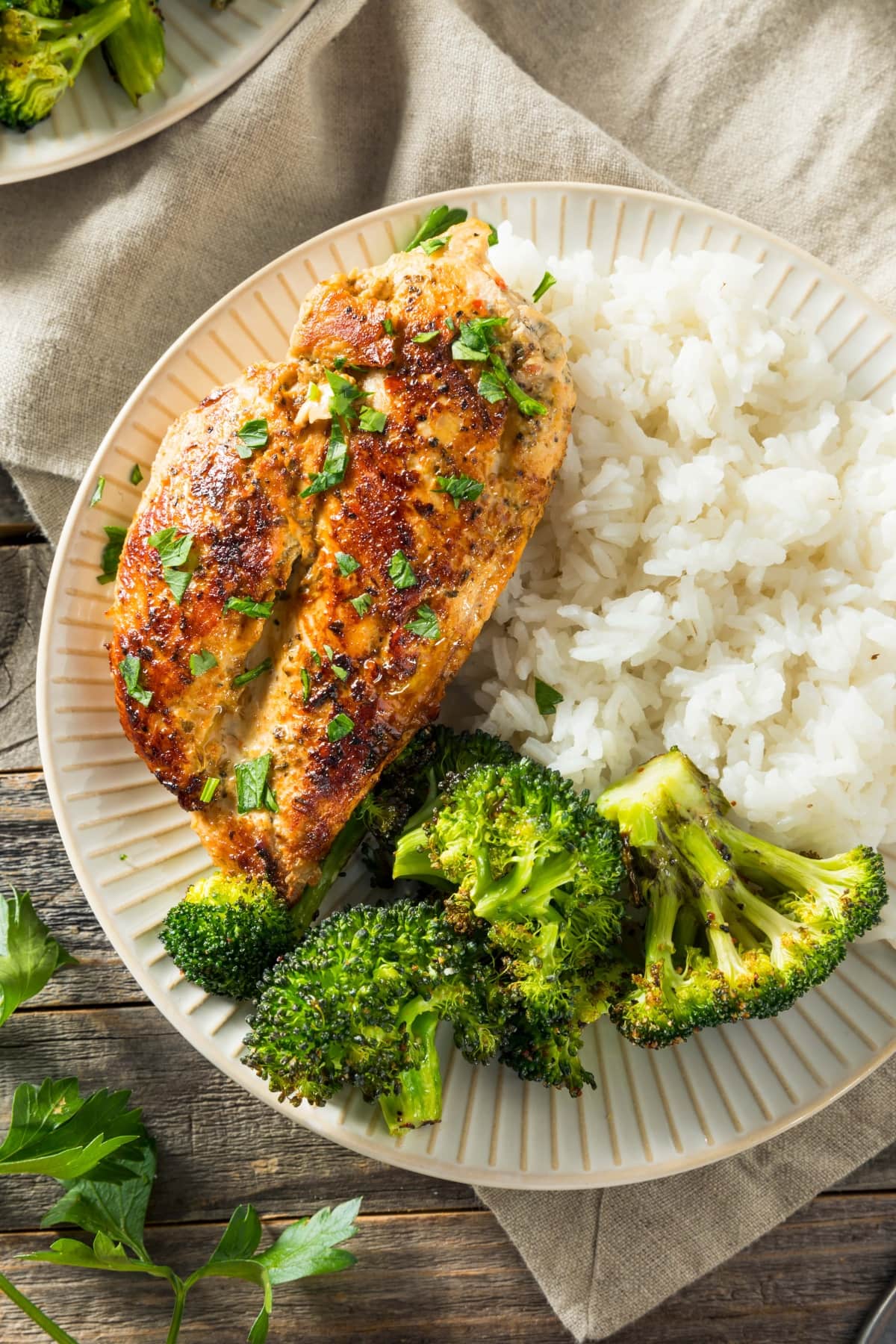 Homemade Baked Chicken Breast with Broccoli and Rice in a Plate