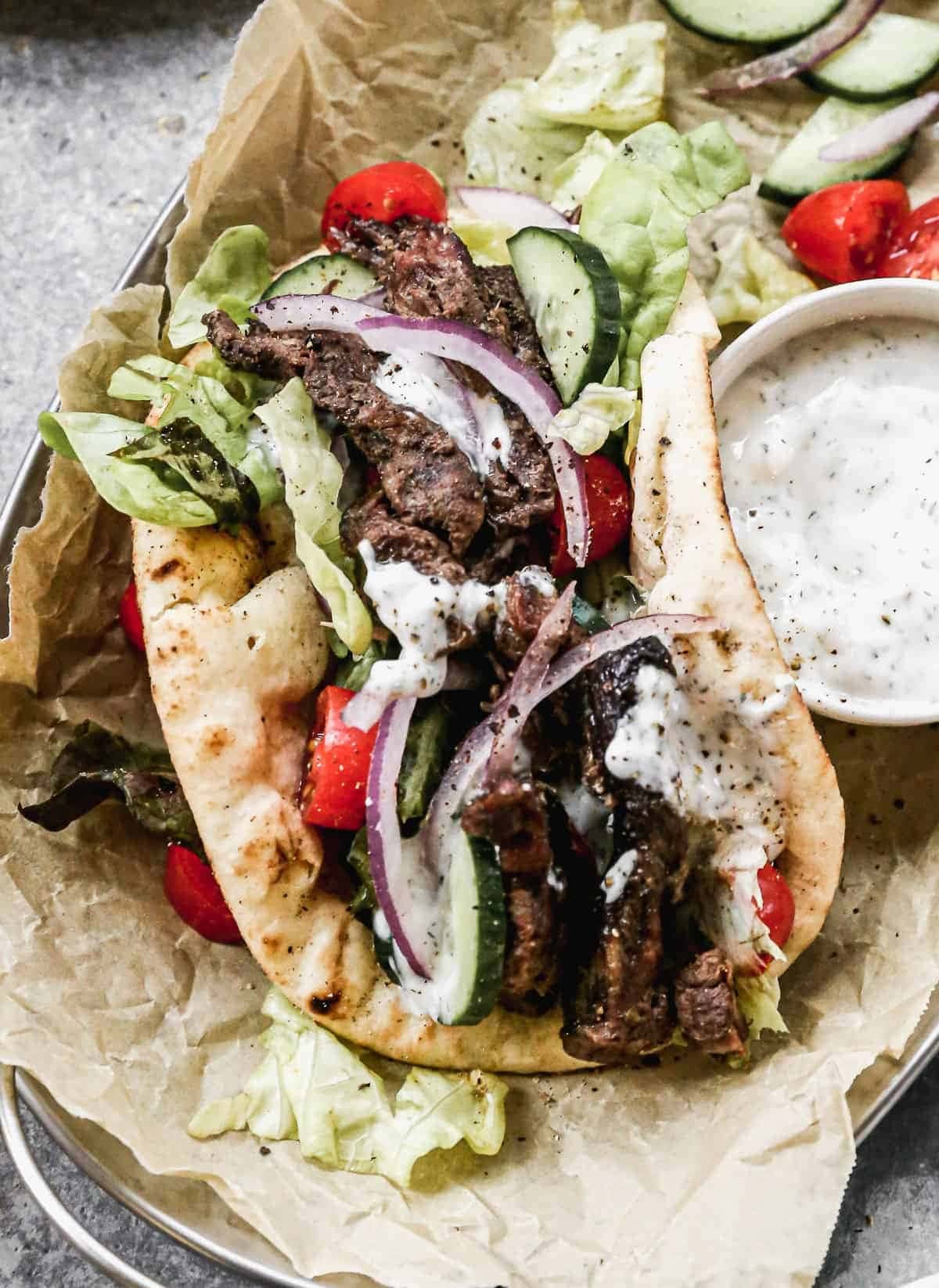 Taco with Beef Gyros, tomatoes. cucumber, onion and  tzatziki sauce filling