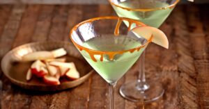 Caramel Apple Martini with Sauce and Vodka on a Wooden Table