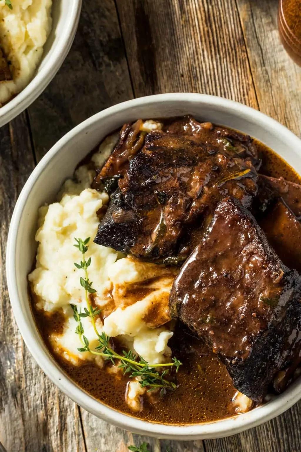 Braised short ribs beef served with mashed potatoes. 