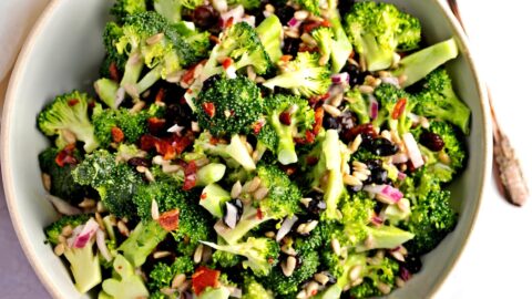 Homemade Raisin Salad in a Bowl with Bacon, Raisins, Onions and Sesame Seeds