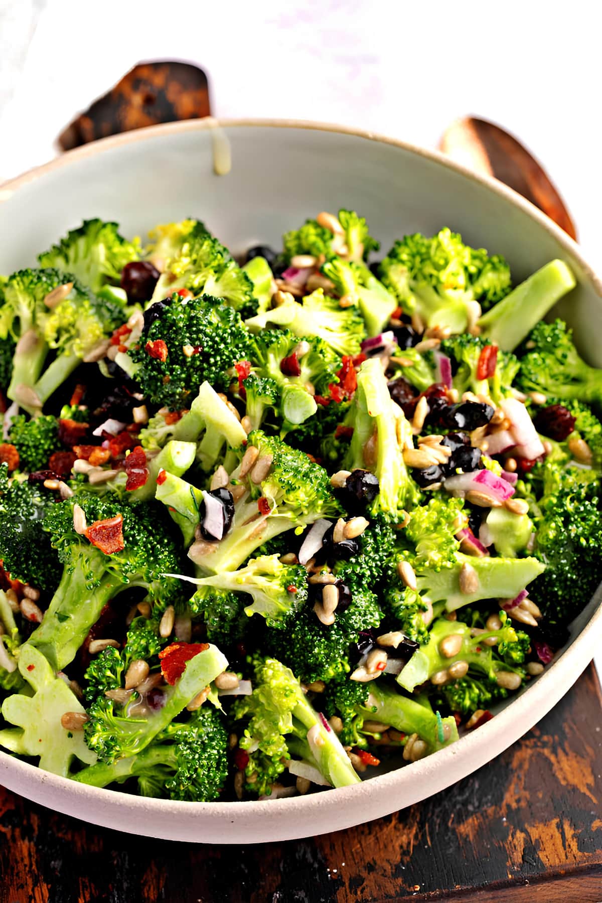 Salad with broccoli, raisin and nuts in a bowl. 