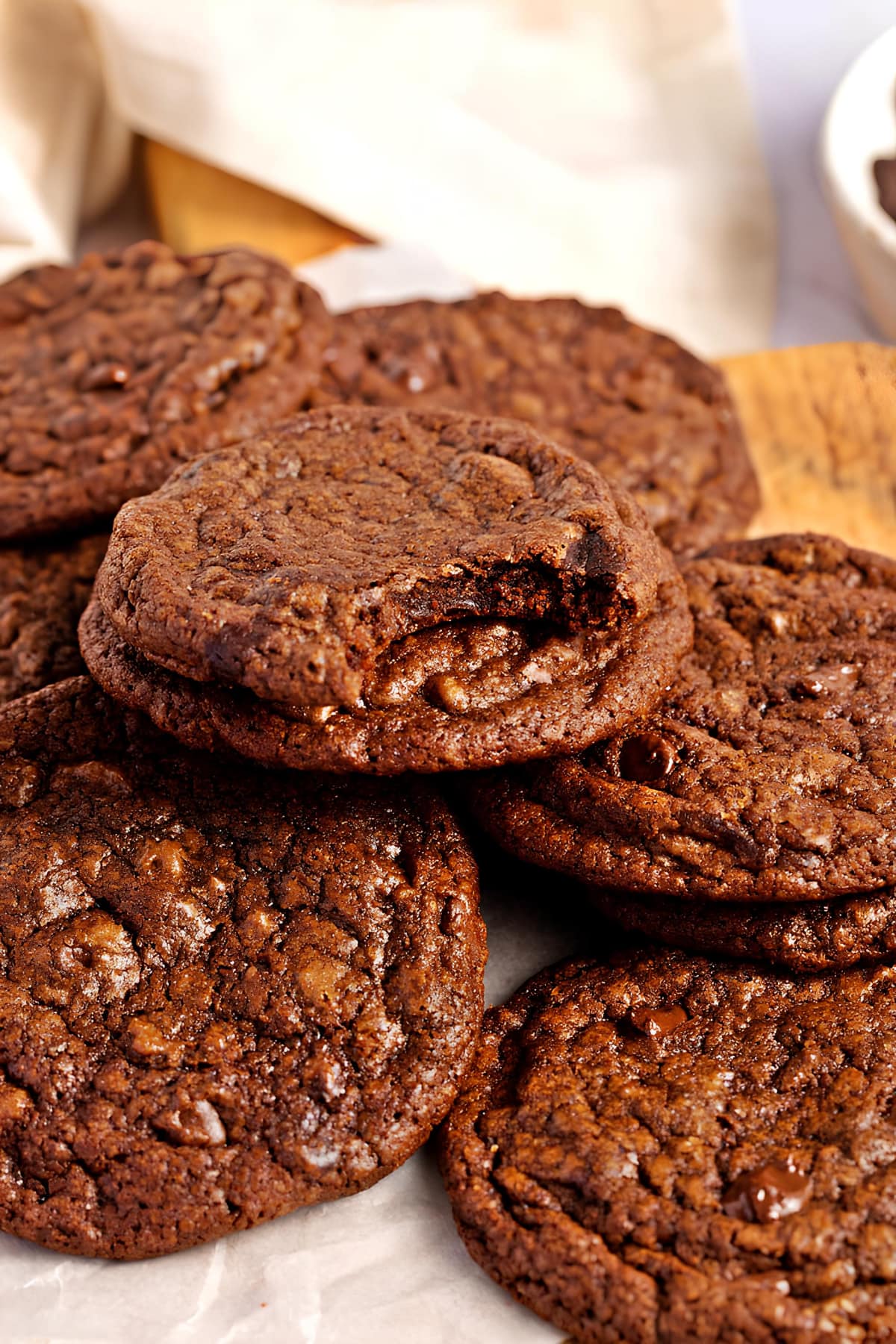 Fudgy Brownie Cookies (Best Recipe) featuring a bunch of fudgy brownie cookies served on a white plate. 
