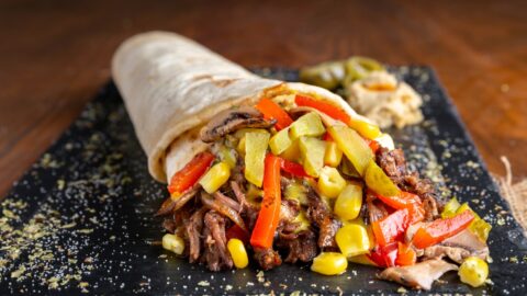 Homemade Tortilla Wrap Burritos with Turkey Meat, Corn and Peppers