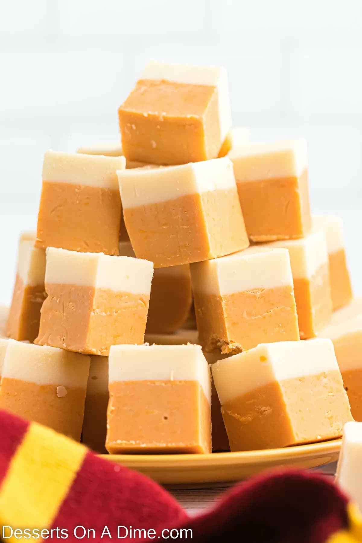 Stack of sliced butterscotch flavored fudge on a plate. 