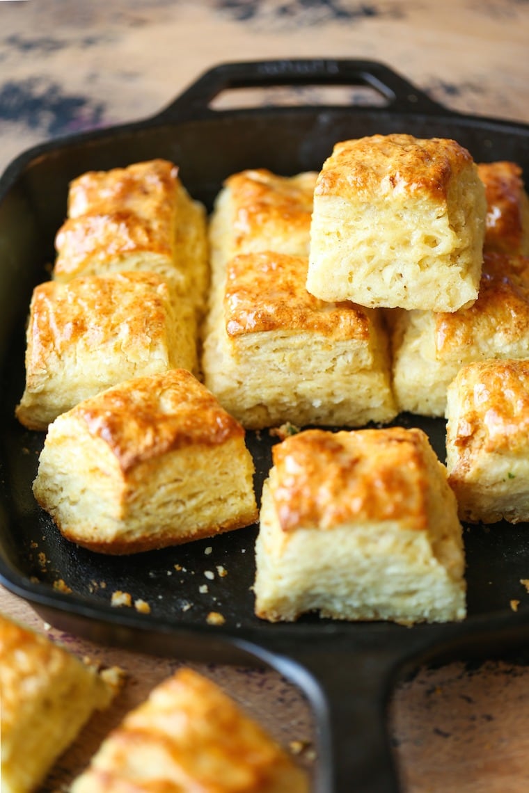 A table with a pan filled with freshly baked biscuits