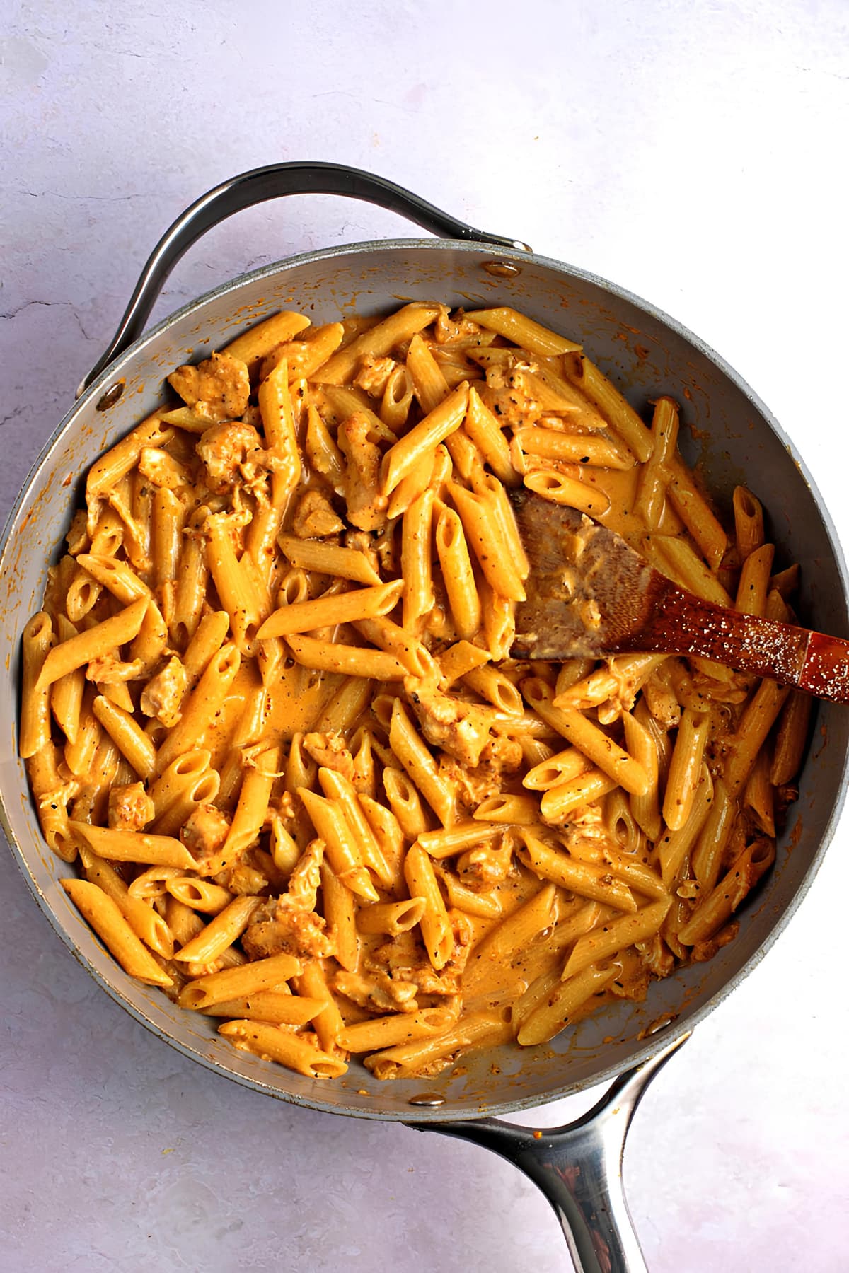 Cajun chicken pasta in a large pan, top view