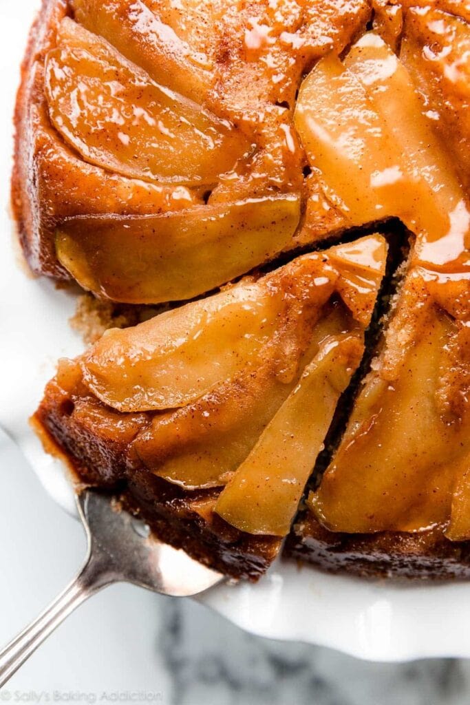 Portion sliced caramel apple upside down cake.