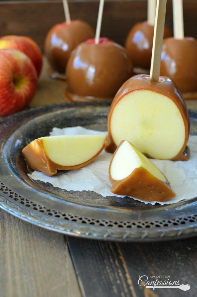 Apples on stick coated with caramel syrup. 