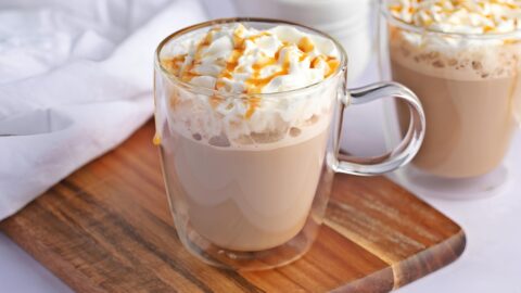 Caramel macchiato served in glass mug