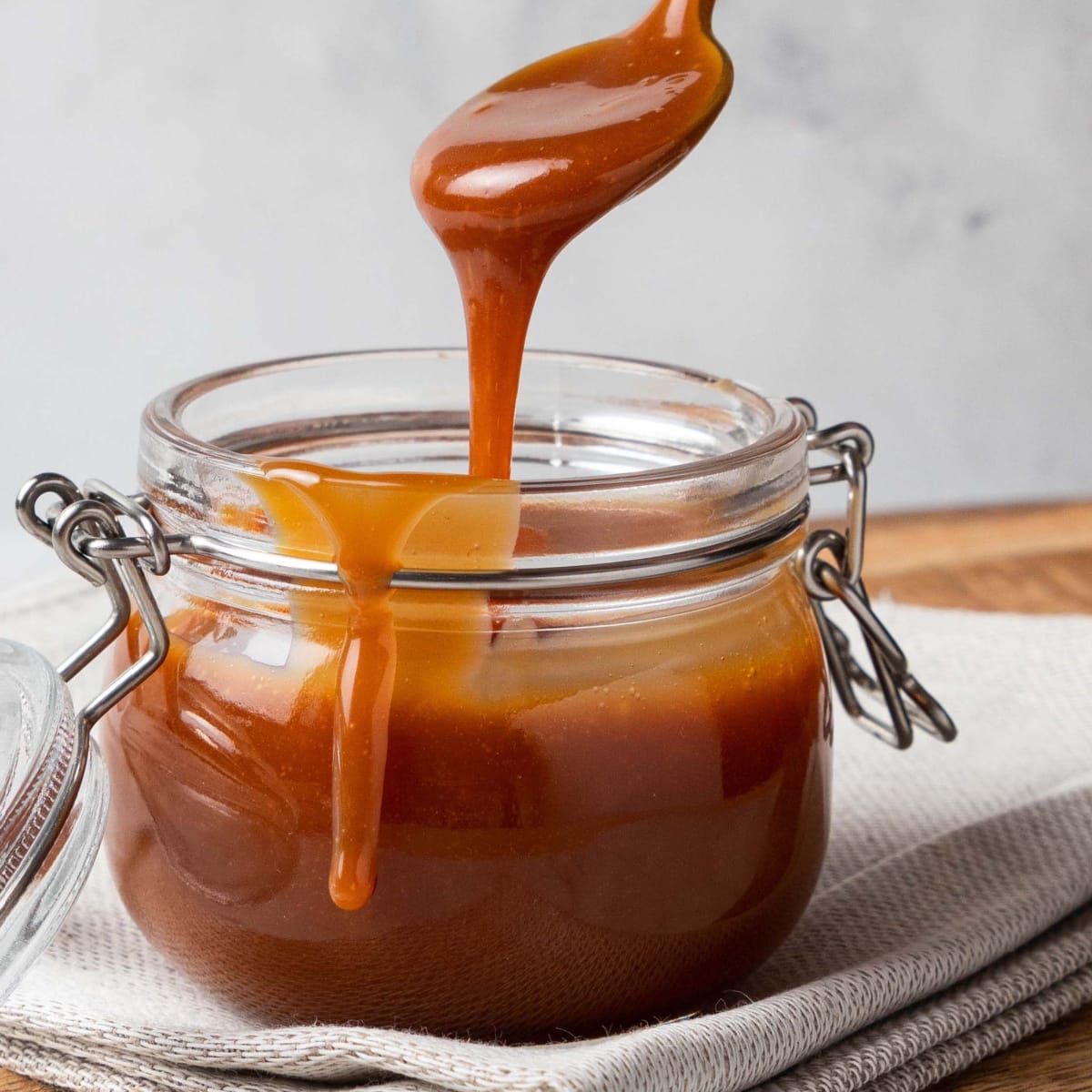 Caramel sauce on a glass jar. 