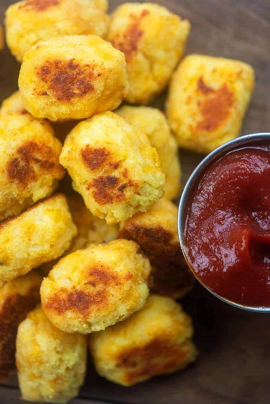 Bunch of cauliflower tots with dip. 