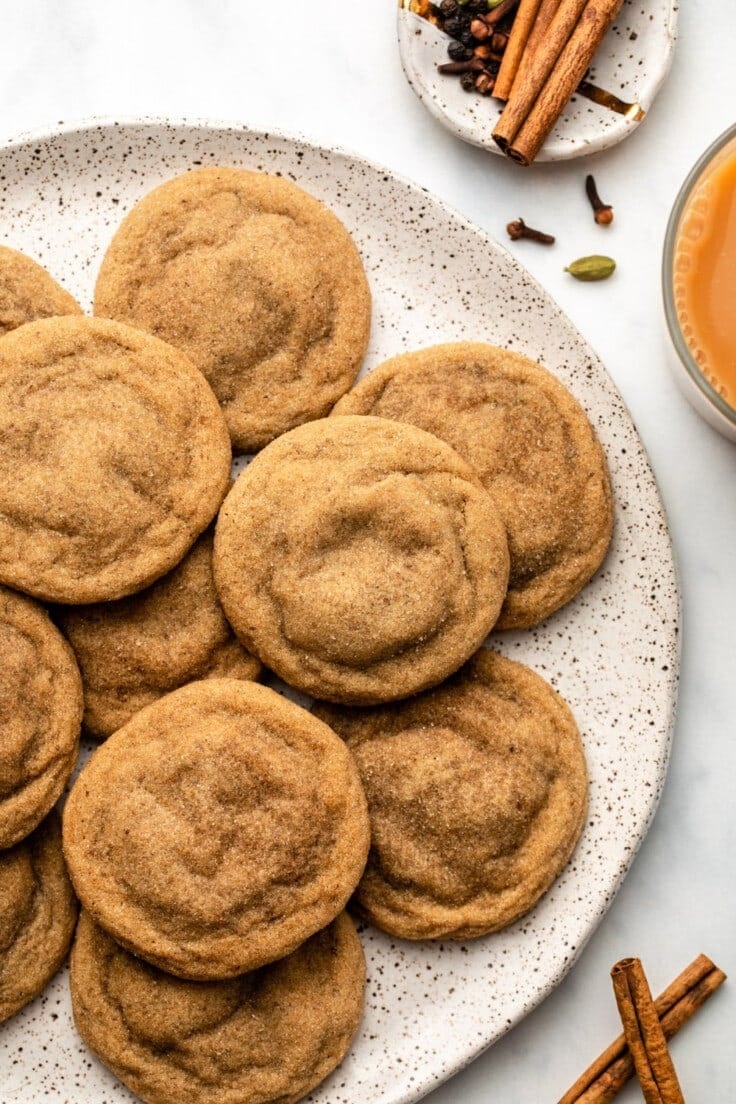 Bunch of chai sugar cookies on a plate.