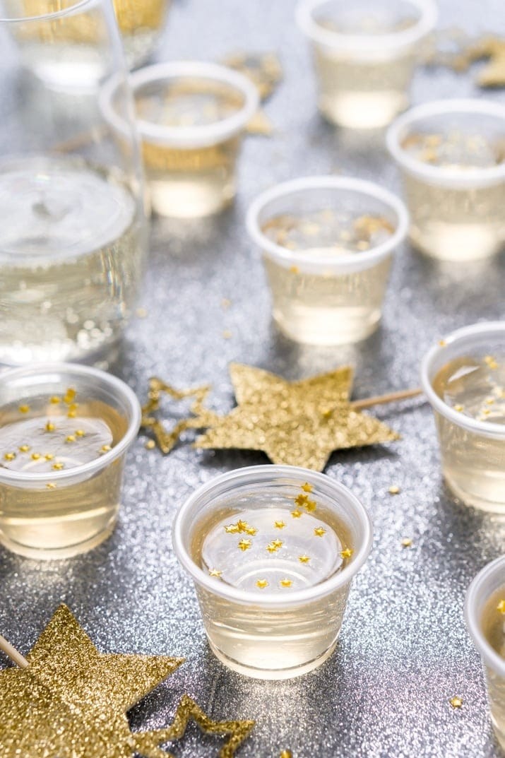 Champagne jello shots decorated with stars sprinkles. 