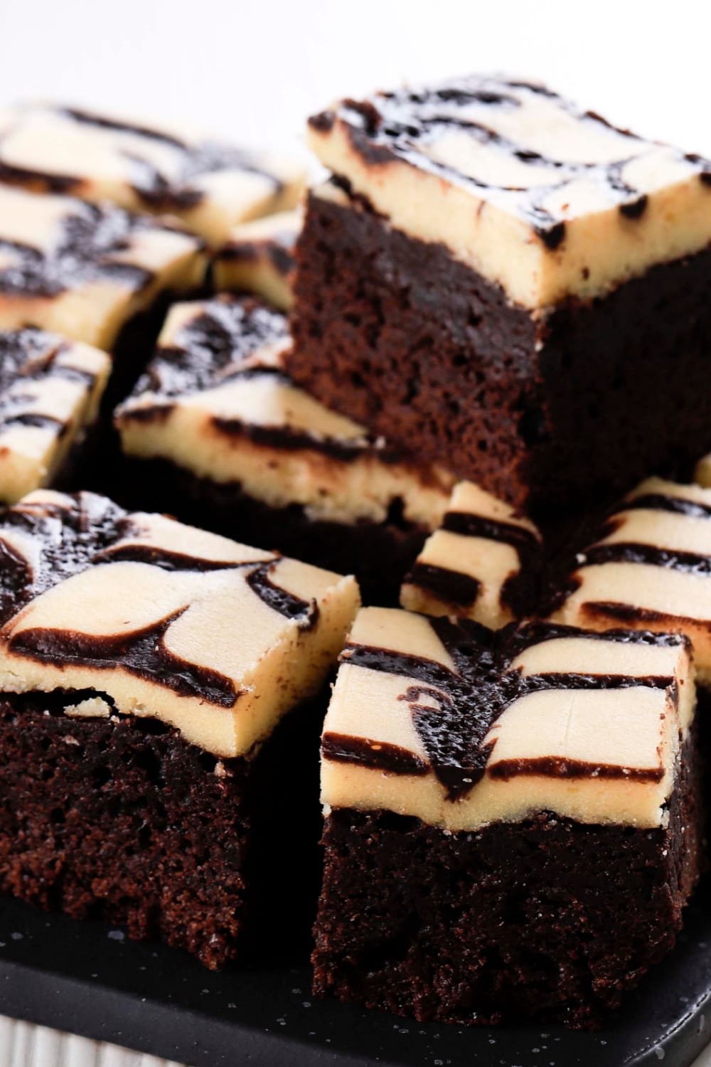 Cheesecake brownies slices on a pan. 