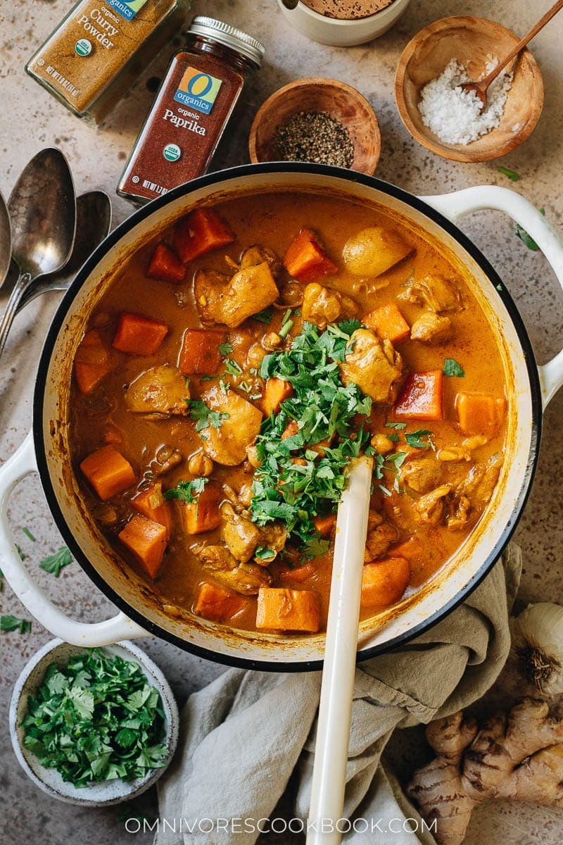 Chicken and sweet potato curry on a pot. 