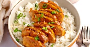 Delicious homemade chicken and rice with soy glaze in a bowl