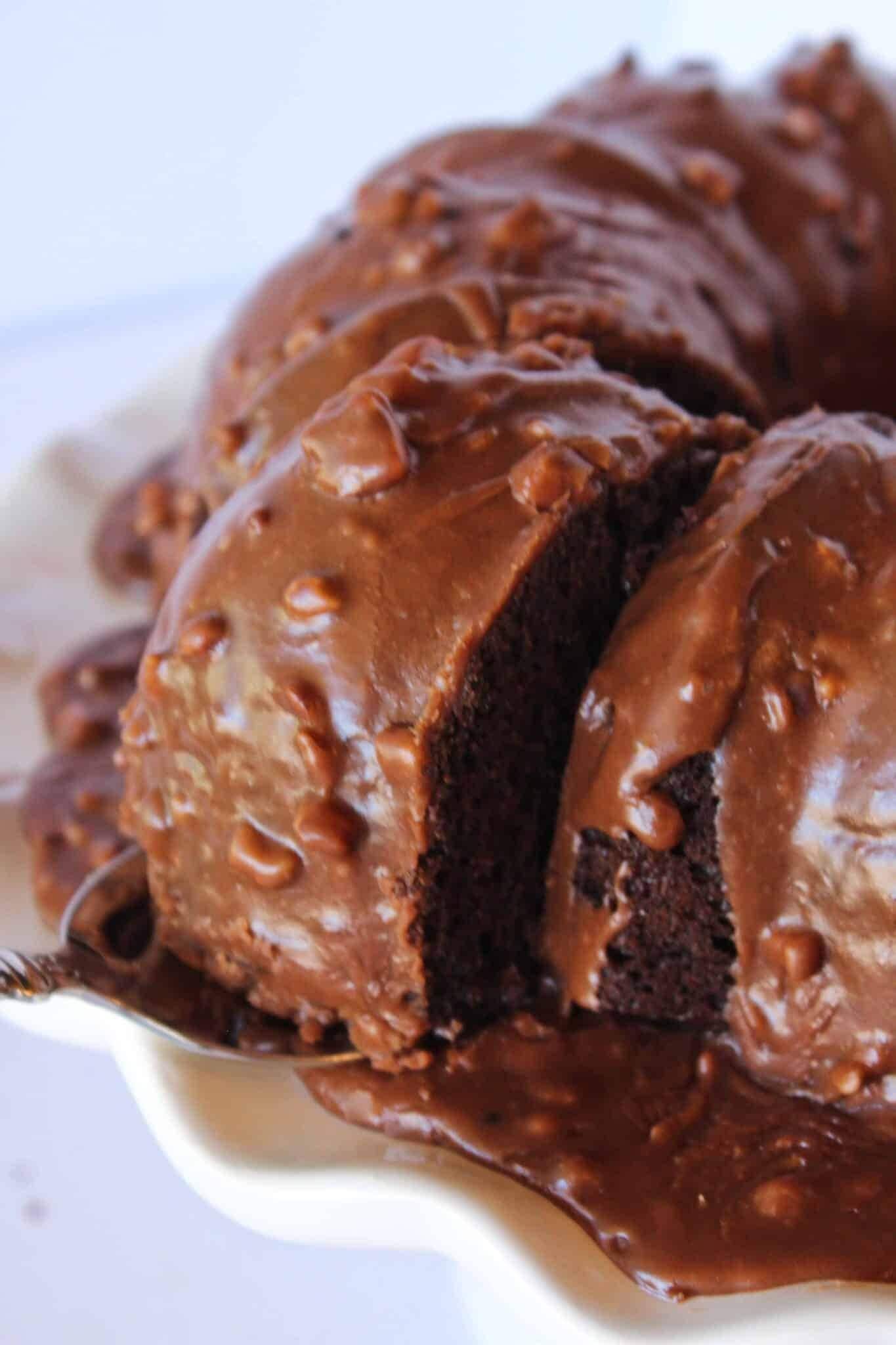 Chocolate bundt cake covered with melted chocolate. 