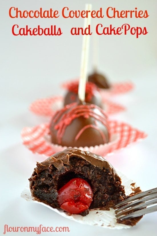 Chocolate pops with cherries in the middle sliced with a fork. 
