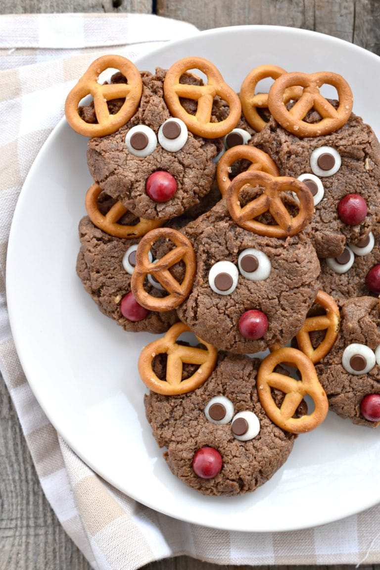 Bunch of Chocolate peanut butter reindeer cookies on plate. 