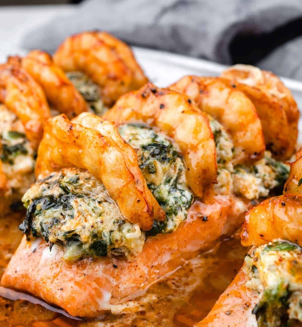 Salmon stuffed with crab, shrimp, spinach, Boursin cheese, Parmesan, and garlic. 