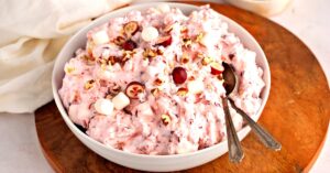 Sweet, Soft and Crunchy Cranberry Fluff with Marshmallows and Nuts in a Bowl