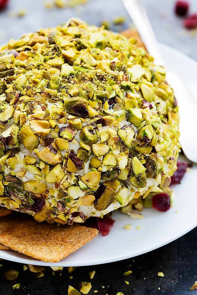 Chopped pistachio and dried cranberry coated cheeseball. 