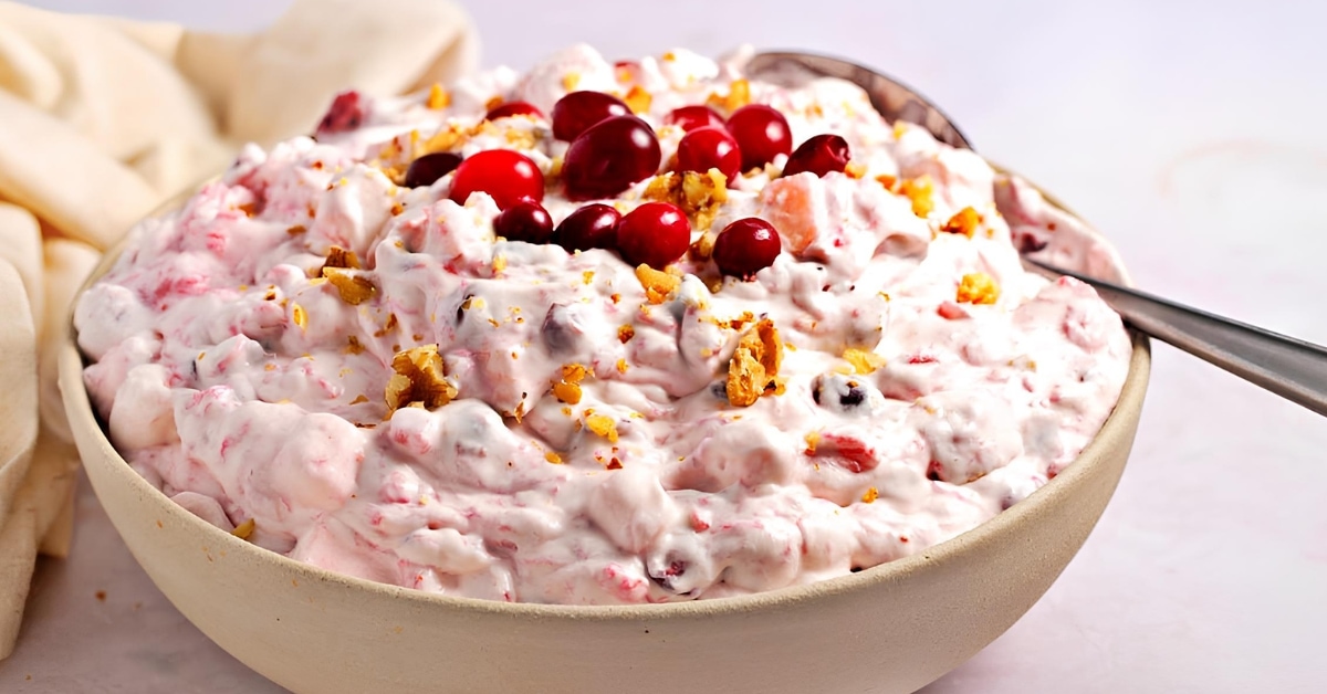 Creamy Salad in a Bowl with cranberries on top.