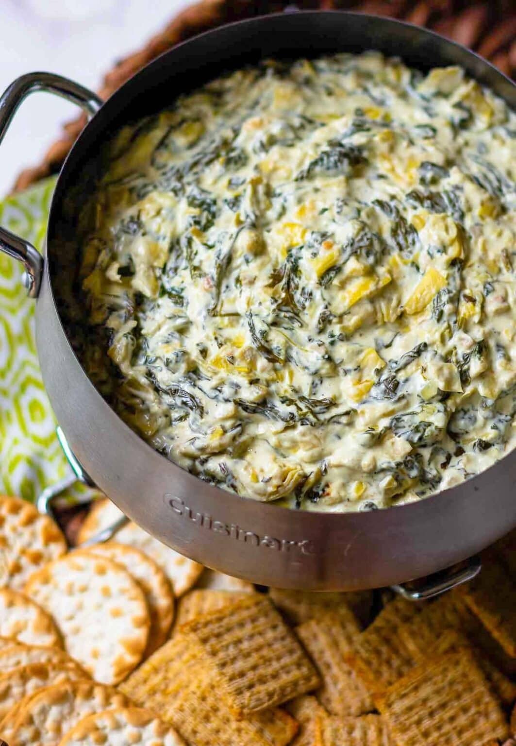 Creamy spinach and artichoke dip on a pot.