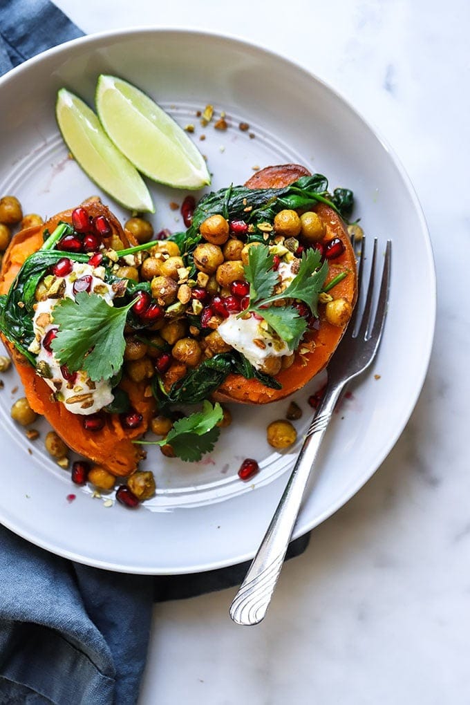 Curry Chickpea Stuffed Sweet Potatoes garnished with parsley and lime slice