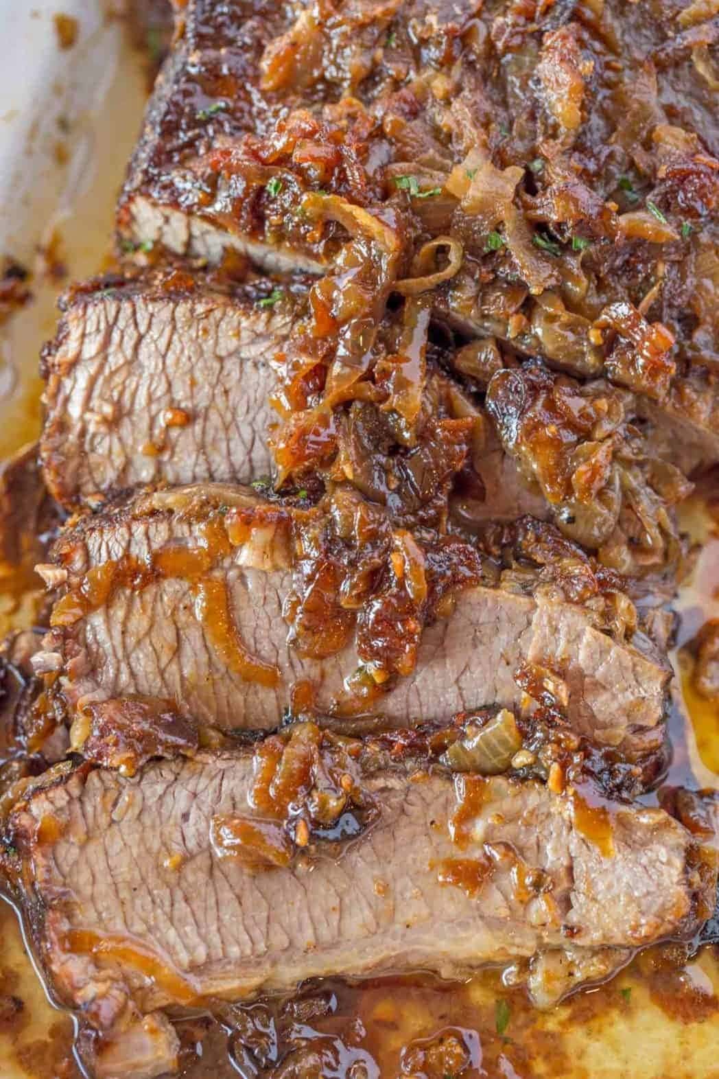 Sliced low-and-slow cook brisket with caramelized onions. 