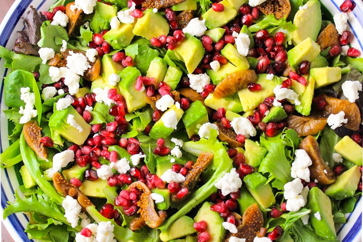 Salad with  fig salad with pomegranates, avocado and balsamic dressing. 
