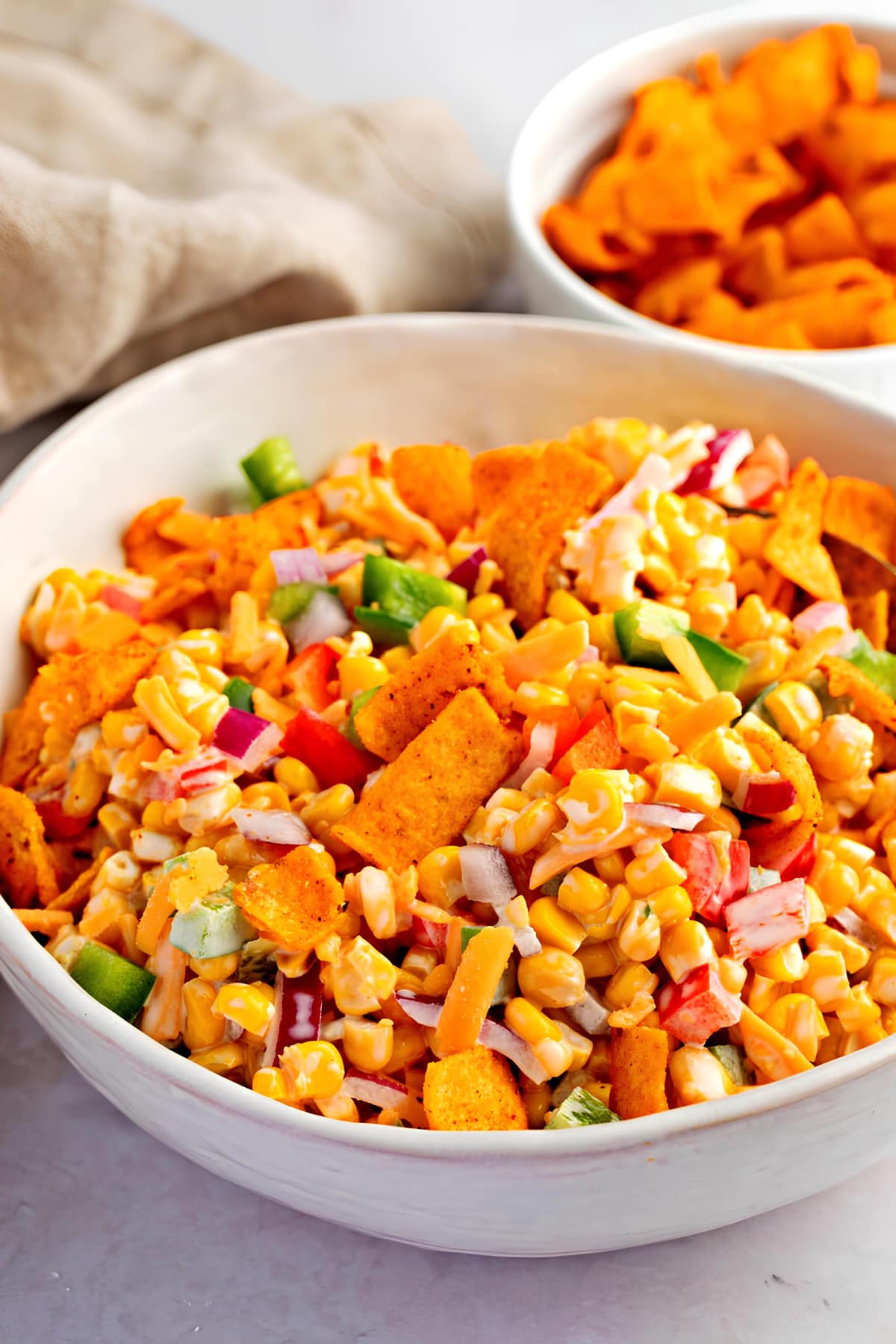 Creamy and Appetizing Frito Corn Salad with Vegetables in a Bowl