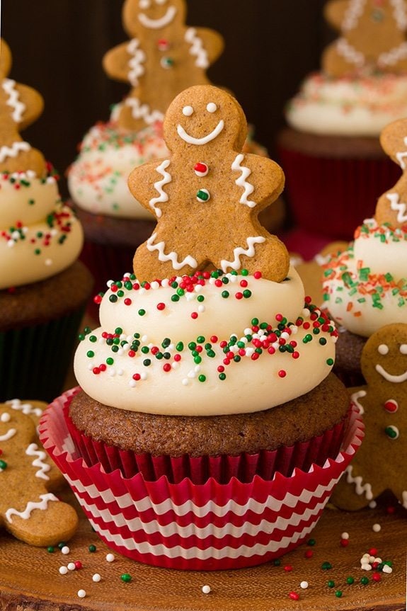 Gingerbread cupcakes with cream cheese frosting and sprinkles.