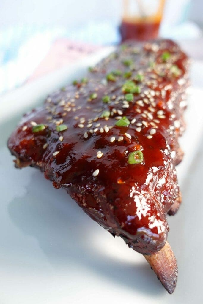 Savory meat in a sweet and sticky gochujang bbq sauce with sesame seeds and green onions