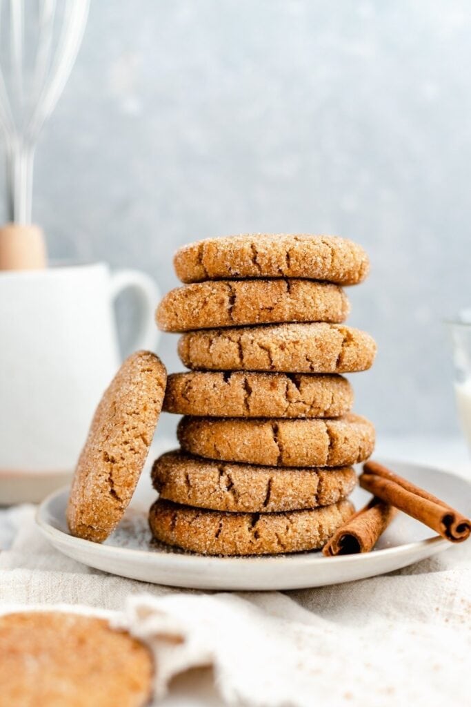 A pile of snickerdoodle cookies on a plate. 