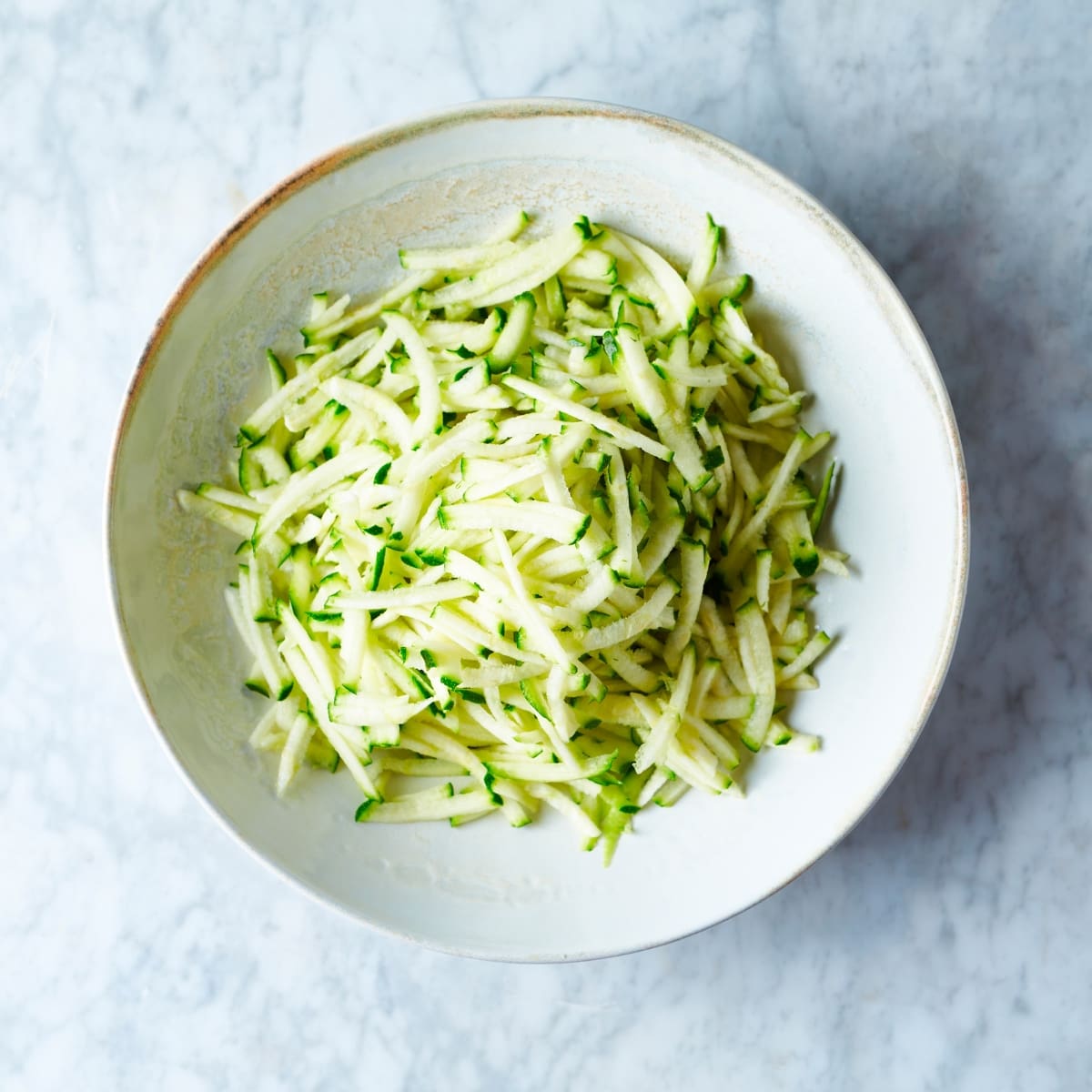 Grated Zucchini in a Bowl Top View