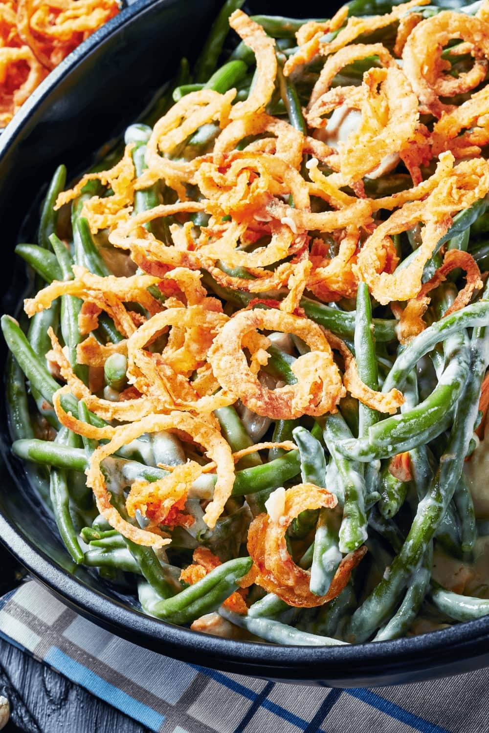 Green bean casserole topped with fried onions. 