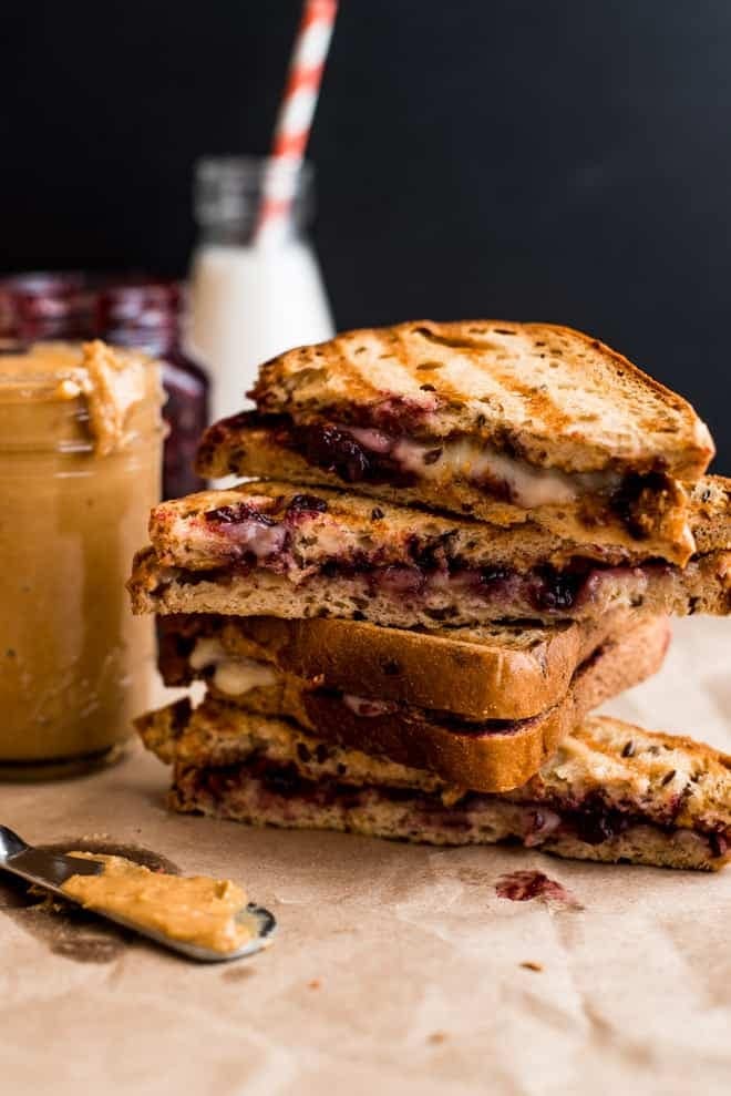 Stack sliced grilled sandwich with peanut butter and jelly with brie.