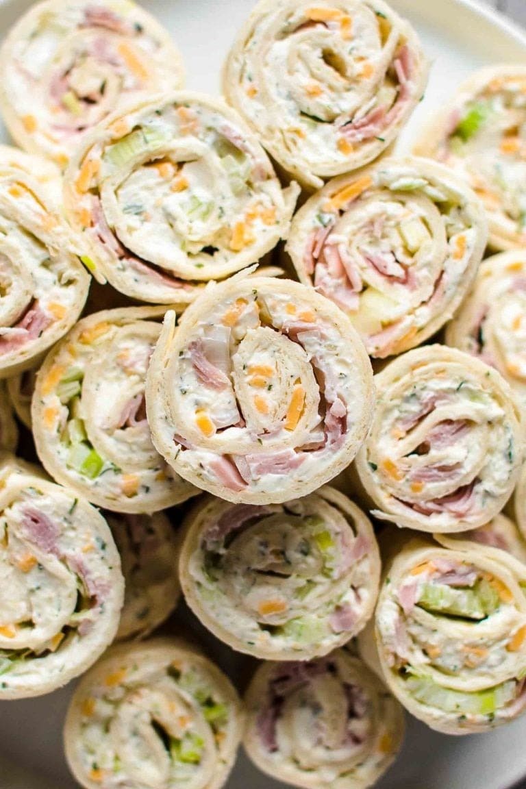 Bunch tortilla roll up made with of cheese, ham, ranch, and green onions