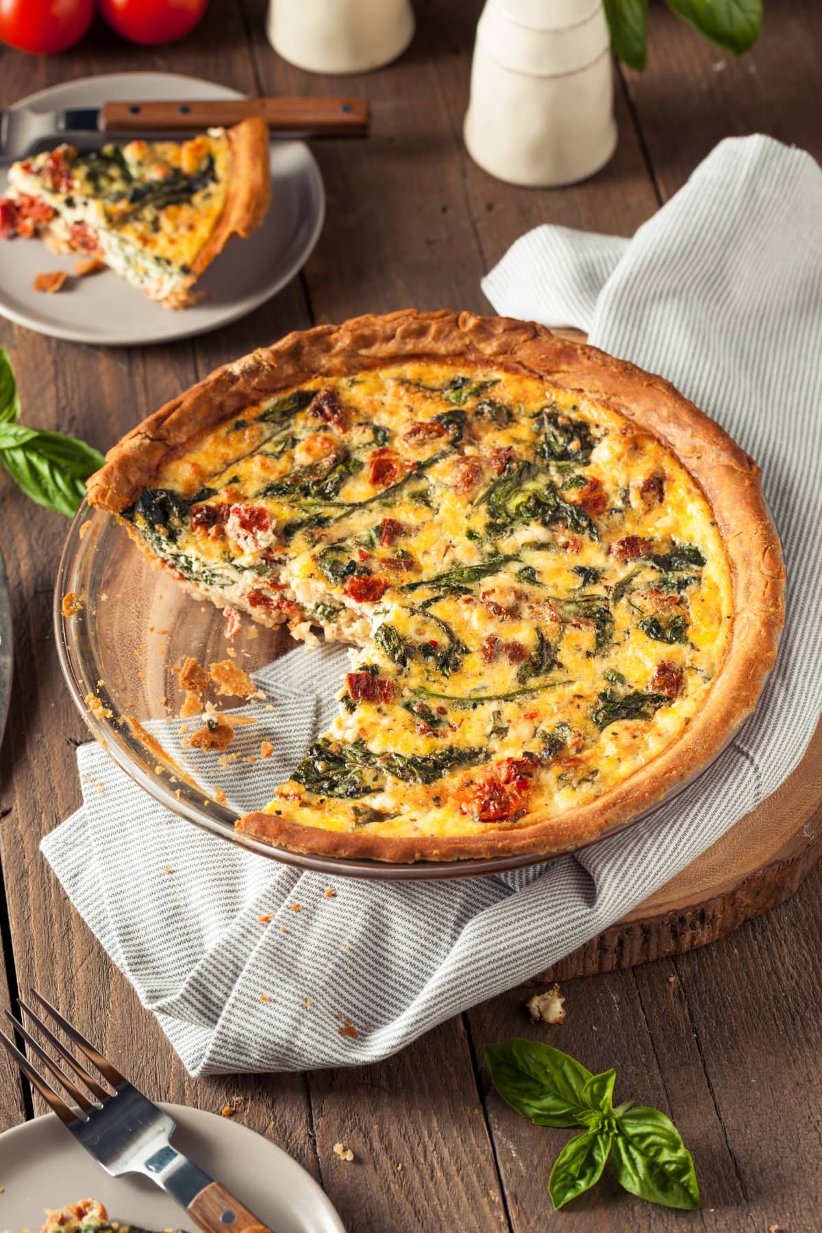 Homemade Egg Quiche for Breakfast with Spinach and Tomatoes